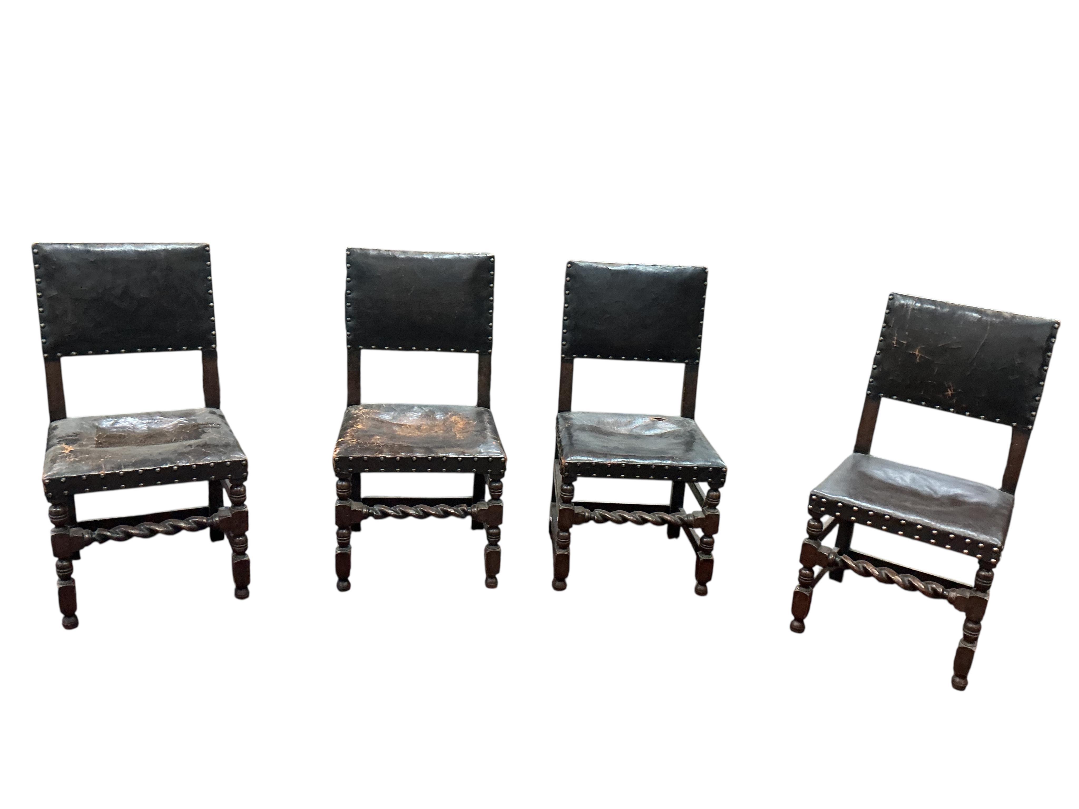 A set of eight Tudor style oak dining chairs, two with arms